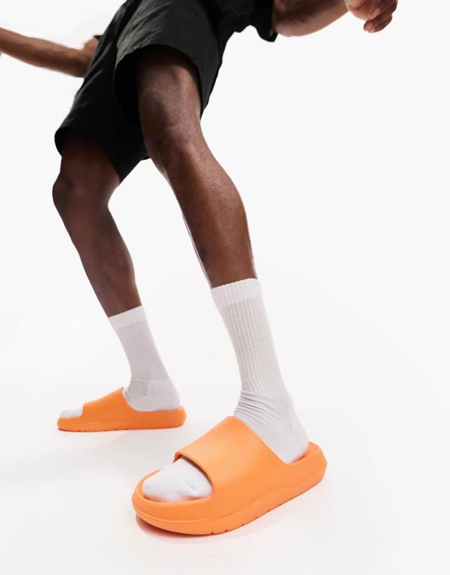 ASOS DESIGN chunky sliders in orange