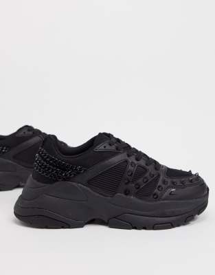 black trainers with studs