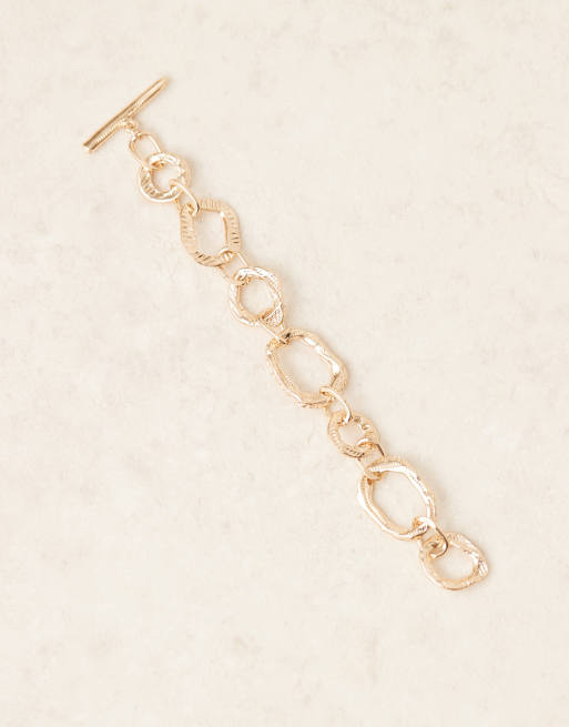 ASOS DESIGN chunky t-bar bracelet in textured gold tone, 2 of 3