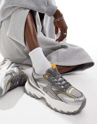  chunky trainers in white with silver and yellow panels