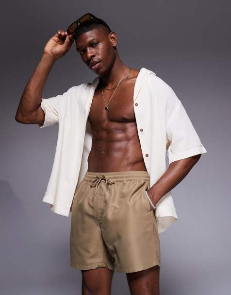 ASOS DESIGN swim shorts in mid length in dark stone