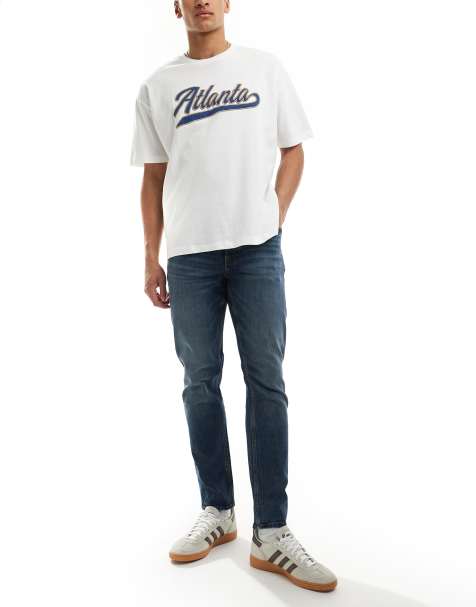 ASOS DESIGN slim fit jeans in with vintage tint in dark wash blue
