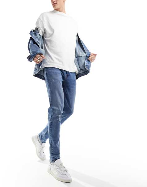 ASOS DESIGN – Ciemnoniebieskie jeansy o obcisłym kroju z przetarciami na kolanach - view 1