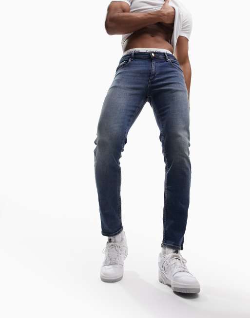 ASOS DESIGN – Ciemnoniebieskie jeansy o obcisłym kroju