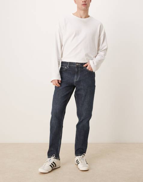 ASOS DESIGN - Ciemnoniebieskie jeansy ze spranego denimu ze stretchem o fasonie ze zwężanymi nogawkami - view 1