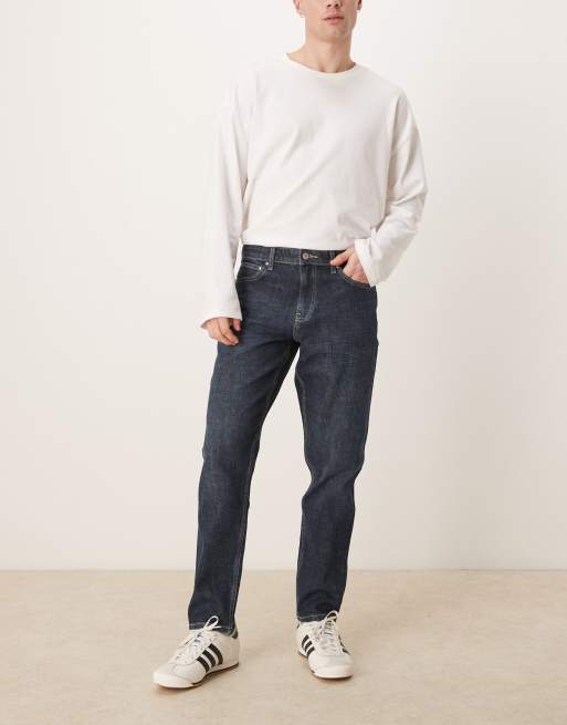 ASOS DESIGN - Ciemnoniebieskie jeansy ze spranego denimu ze stretchem o fasonie ze zwężanymi nogawkami