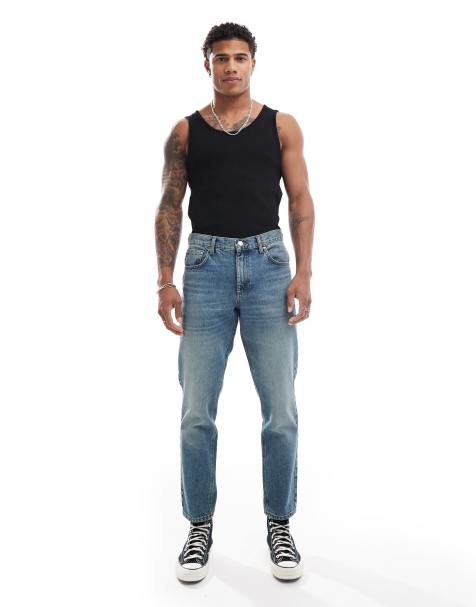 ASOS DESIGN – Ciemnoniebieskie odbarwiane jeansy ze zwężanymi nogawkami - view 1
