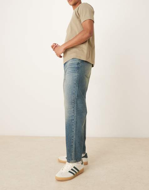 ASOS DESIGN – Ciemnoniebieskie zwężane jeansy o luźnym kroju z efektem przebarwienia - view 1