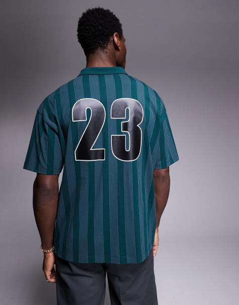 ASOS DESIGN oversized polo with sports graphic in dark green