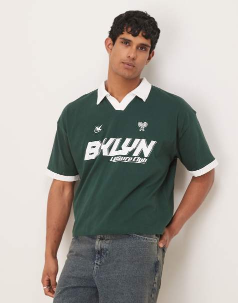 ASOS DESIGN boxy oversized polo with sport graphic in dark green