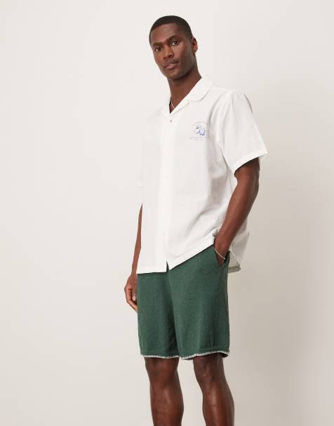ASOS DESIGN oversized knitted shorts with blanket stitch in dark green