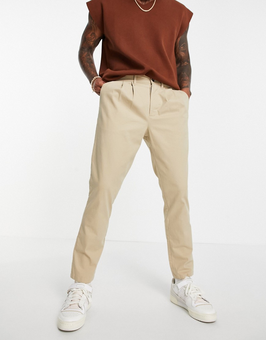 ASOS DESIGN cigarette chinos with pleats in beige-Neutral