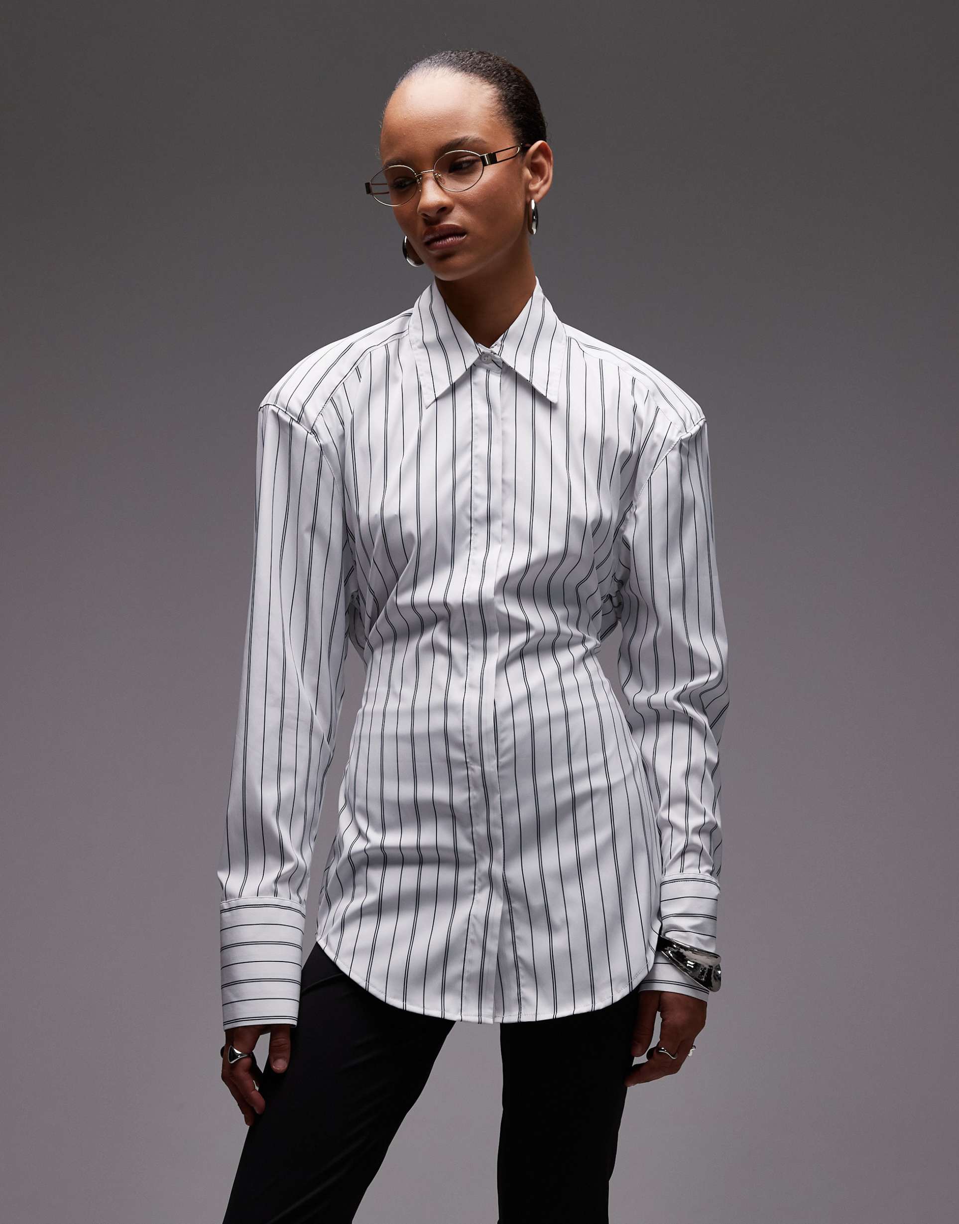 asos design cinched shoulder pads shirt with tie back in black pinstripe