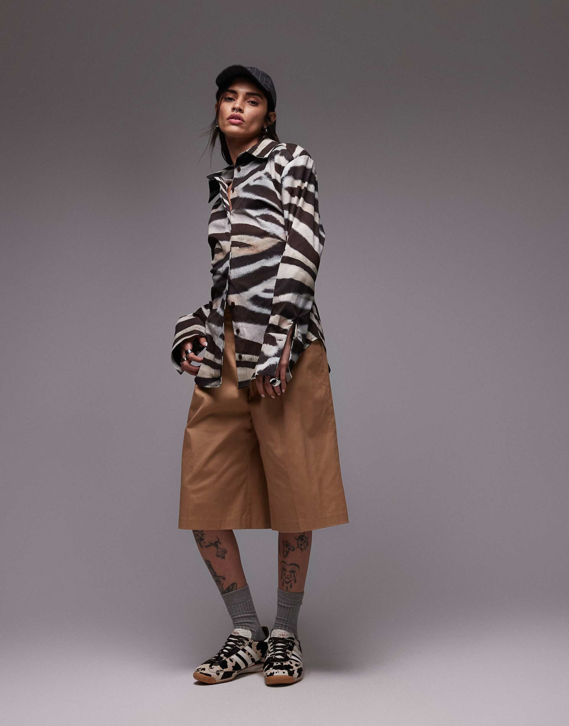 asos design cinched shoulder pads shirt with tie back in zebra print