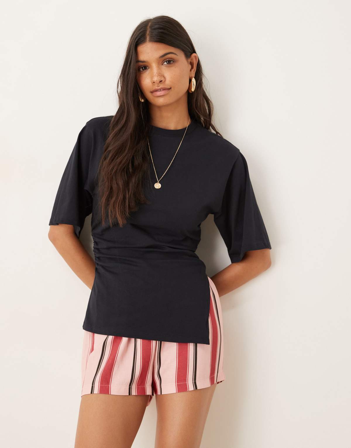 ASOS DESIGN cinched side asymmetric hem tee in navy