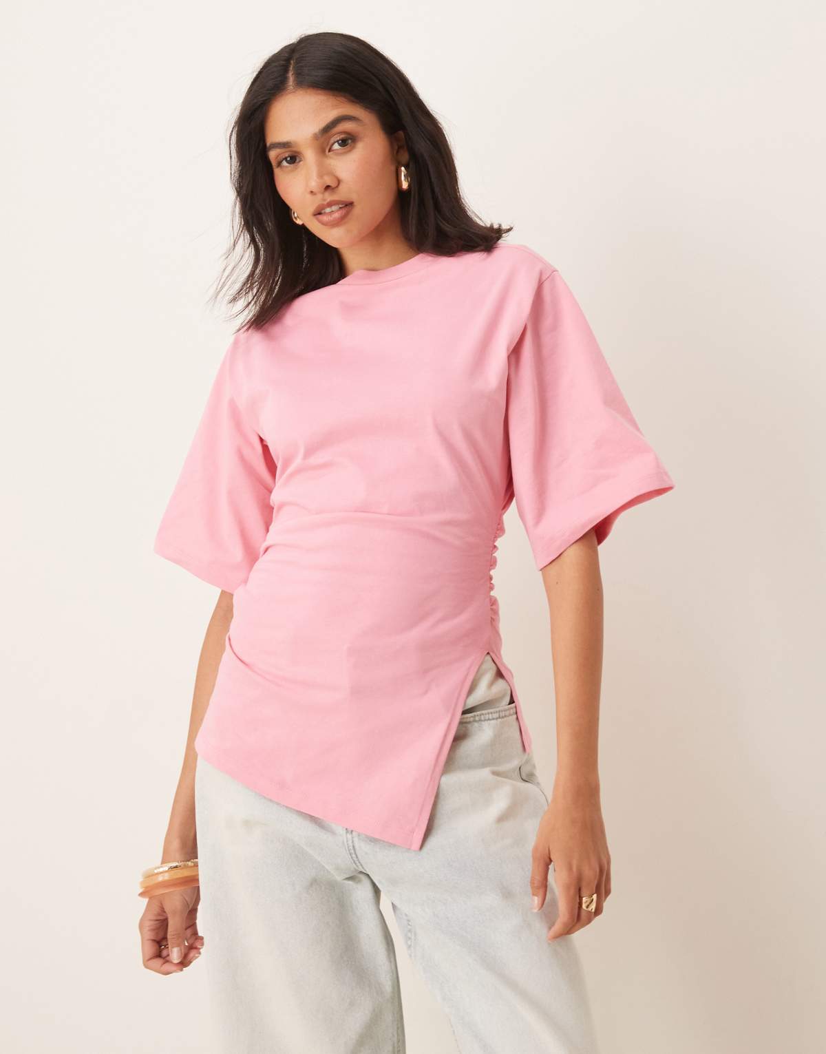 ASOS DESIGN cinched t shirt with asymmetric hem in pink