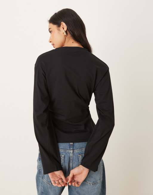 ASOS DESIGN cinched waist asymmetric hem long sleeve tee in black