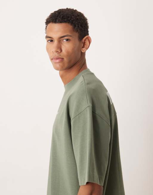 ASOS DESIGN - Circular Design Collection - Oversized T-shirt van superzware stof met Studios-print in groen, 4 van 5
