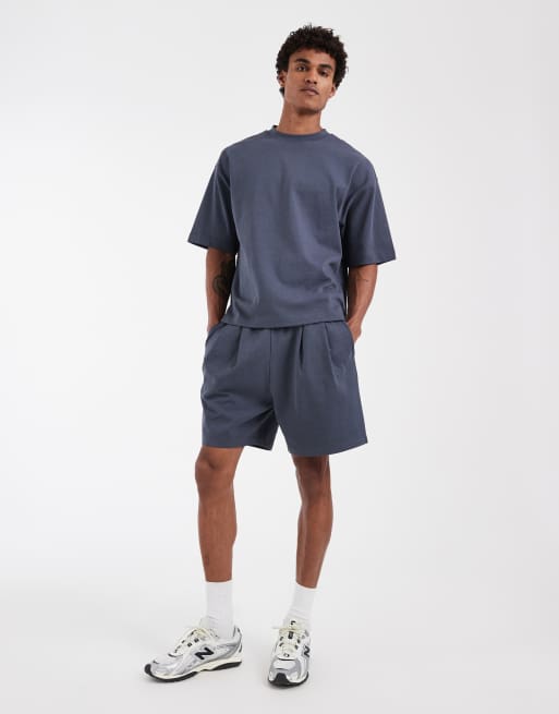 ASOS DESIGN Circular Design Collection pleated oversized jersey shorts in navy, 2 of 5