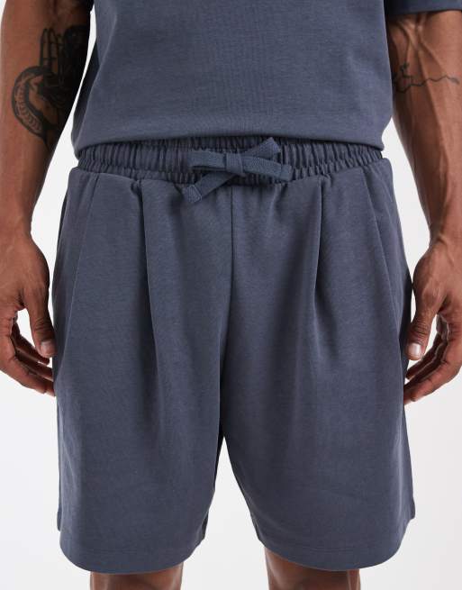 ASOS DESIGN Circular Design Collection pleated oversized jersey shorts in navy, 4 of 5