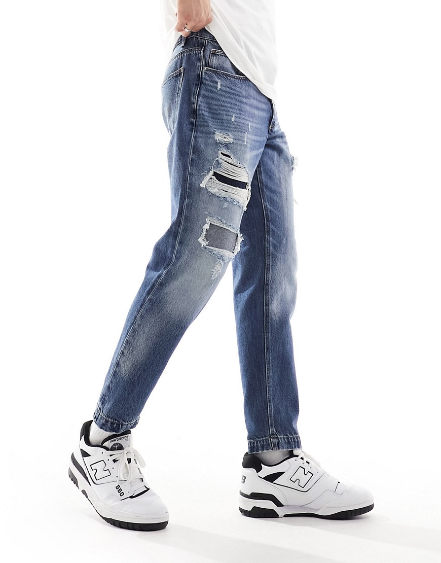 ASOS DESIGN classic rigid jeans with rips in mid wash blue