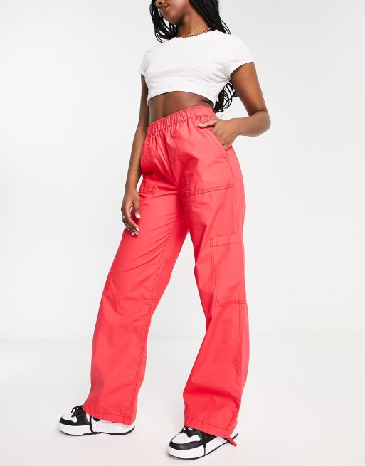 Bershka baggy parachute tech pants in pink