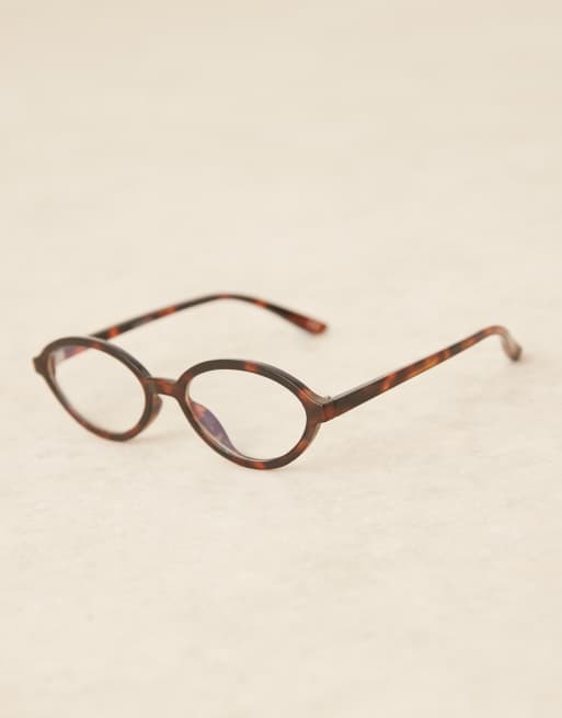 ASOS DESIGN clear blue light lens slim oval glasses in tort, 2 of 3