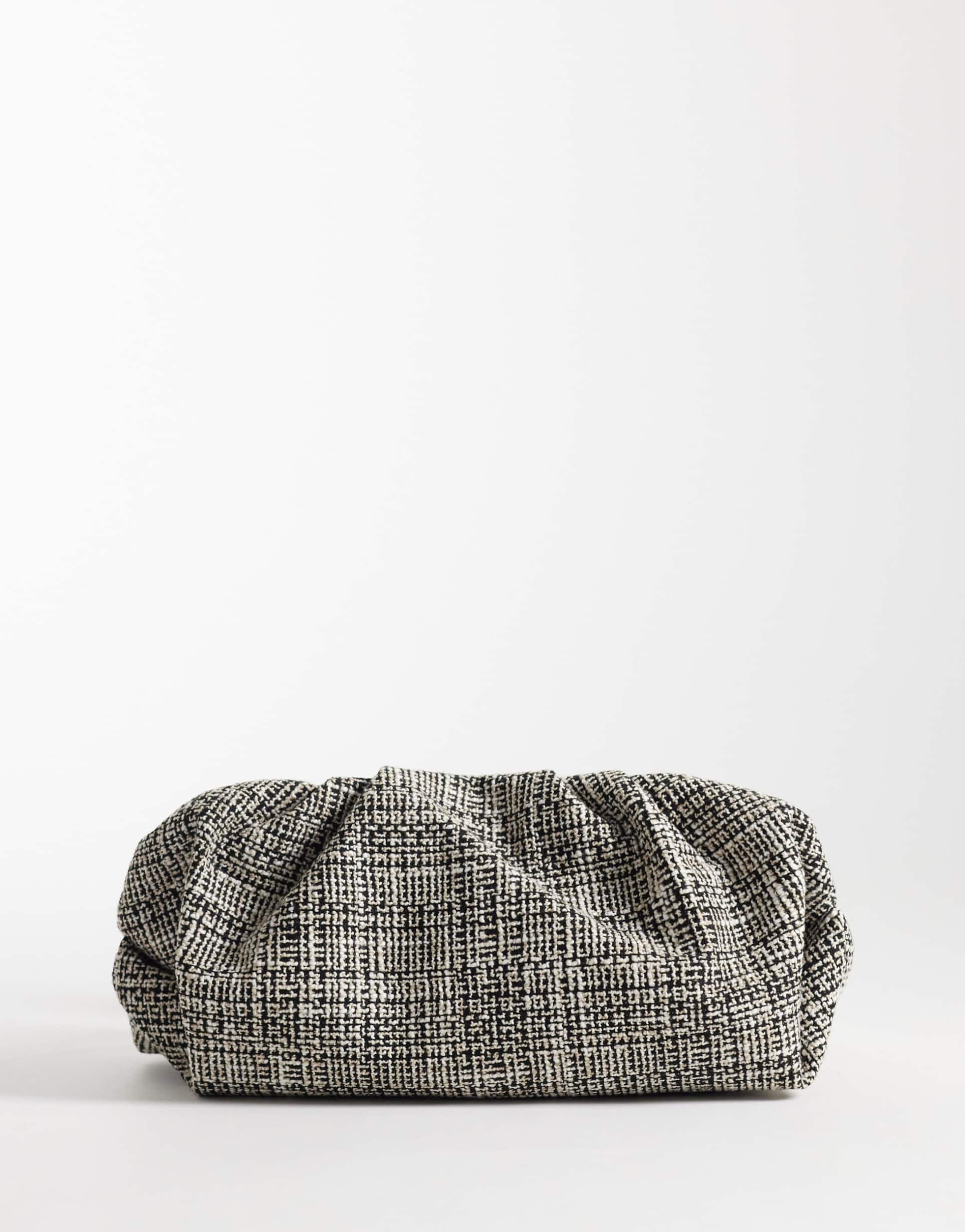 asos design cloud clutch purse in black and white bouclé