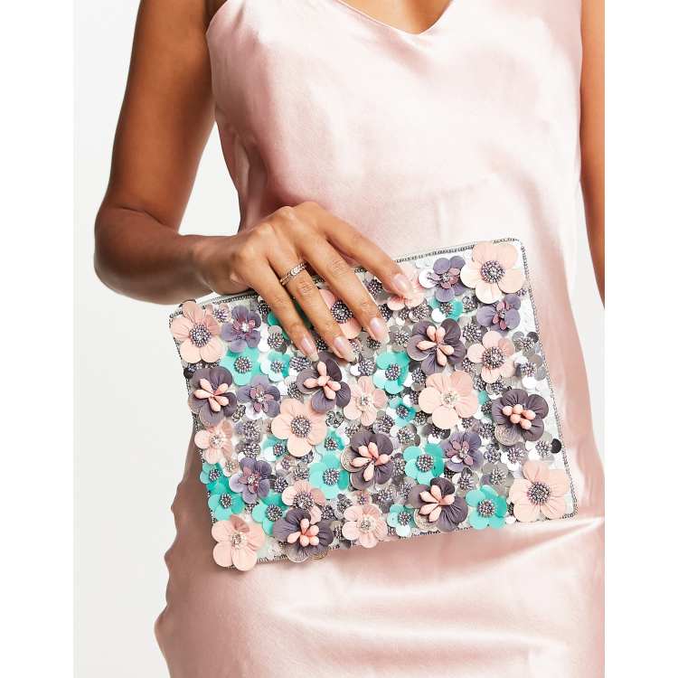 ASOS DESIGN clutch bag with 3D flowers in pink ASOS