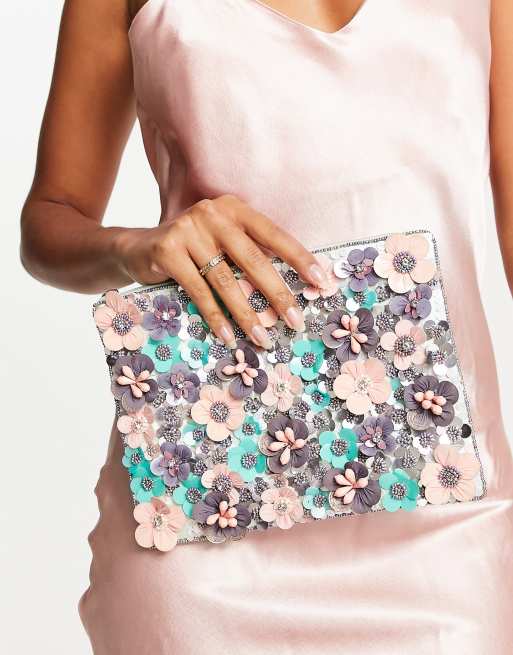 ASOS DESIGN clutch bag with 3D flowers in pink ASOS