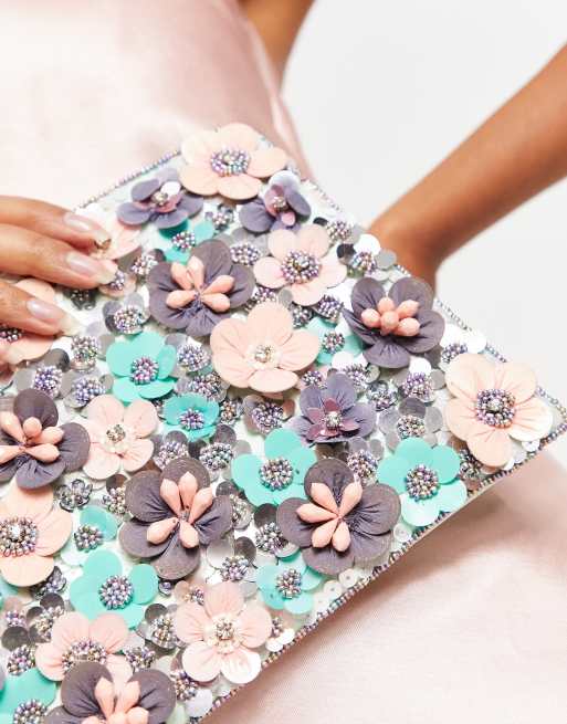 ASOS DESIGN clutch bag with 3D flowers in pink ASOS