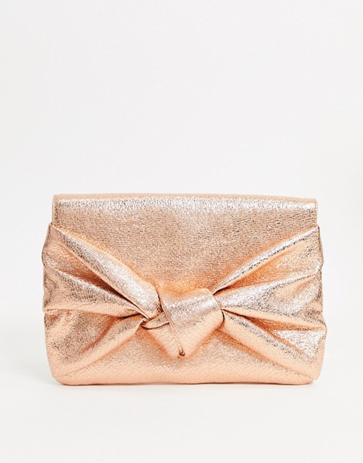 ASOS DESIGN clutch bag with oversized bow in rose gold