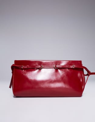 clutch bag with skinny buckle strap detail in red