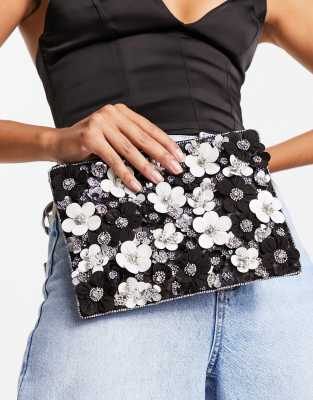 ASOS DESIGN - Clutch in Schwarz mit 3D-Blumendetail