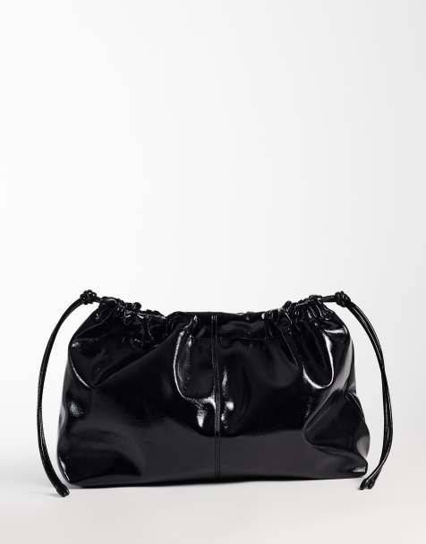 ASOS DESIGN clutch met trekkoord en hoogglansafwerking in zwart - view 1
