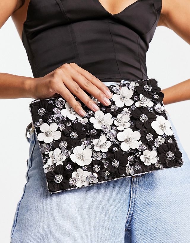 ASOS DESIGN clutch with 3D flowers in black