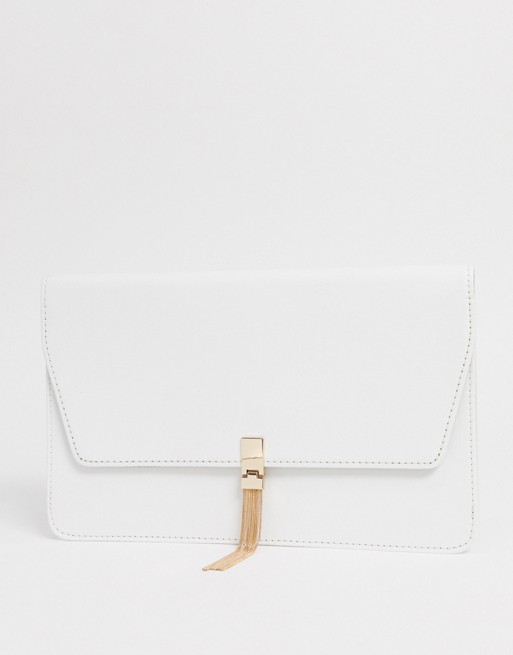 ASOS DESIGN clutch with tab & tassel in white