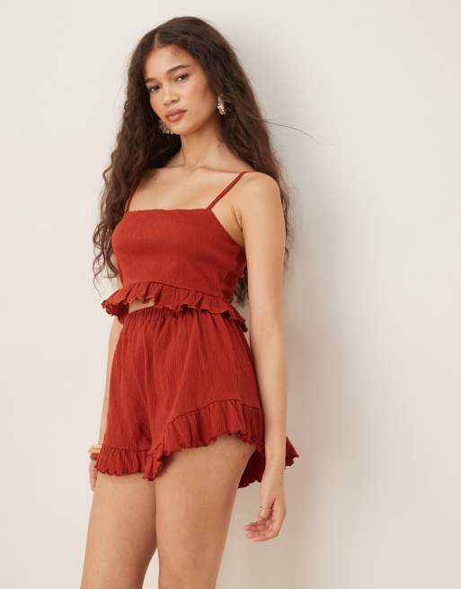 ASOS DESIGN co-ord crinkle flippy shorts with frill hem in rust, 3 of 5