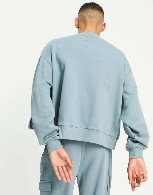 ASOS DESIGN co ord cropped sweatshirt with utility pocket in blue ASOS