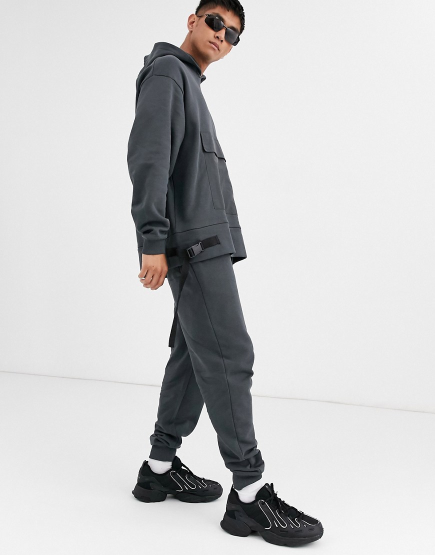 ASOS DESIGN co-ord jersey tapered joggers utility details in washed black