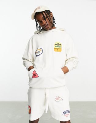 ASOS DESIGN co-ord oversized hoodie in off white with multiplacement fruit sticker print