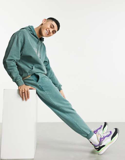 ASOS DESIGN oversized acid wash tracksuit with print in green ASOS