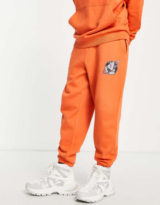 Orange and hot sale white joggers