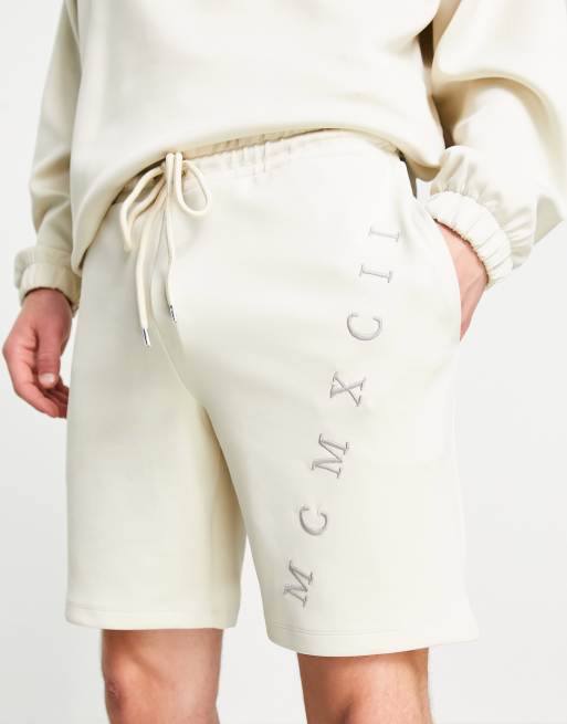 ASOS DESIGN co-ord oversized scuba shorts with Roman numerals embroidery