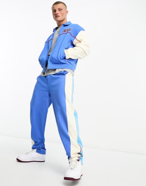 ASOS DESIGN co-ord oversized varsity jersey bomber jacket in blue, 4 of 4