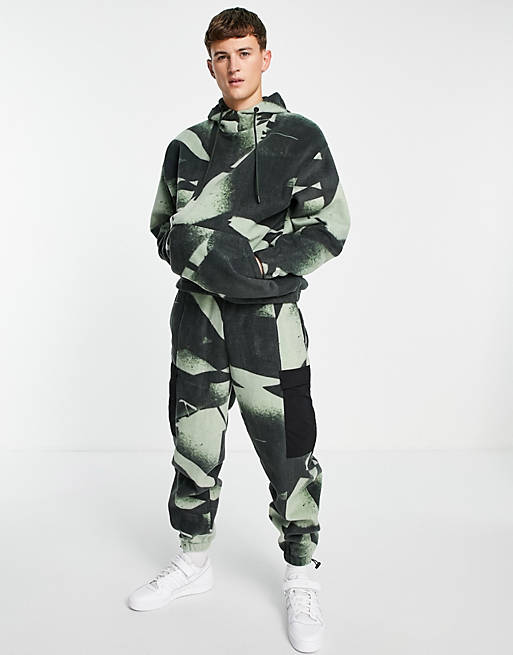 Tracksuits co-ord polar fleece oversized joggers in all camo over print 