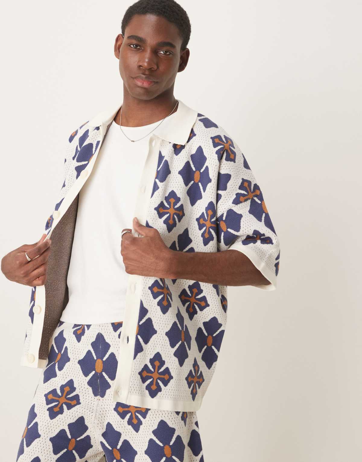 ASOS DESIGN co-ord relaxed knitted button through polo with aztec pattern in blue