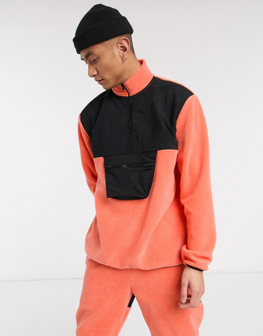 ASOS DESIGN co-ord relaxed polar fleece track jacket with nylon panels & half zip in coral-Orange