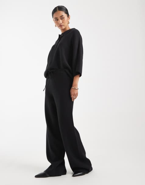 ASOS DESIGN - Co-ord set met rechte polo met verborgen knoopbies en broek met wijde pijpen in zwart - view 1