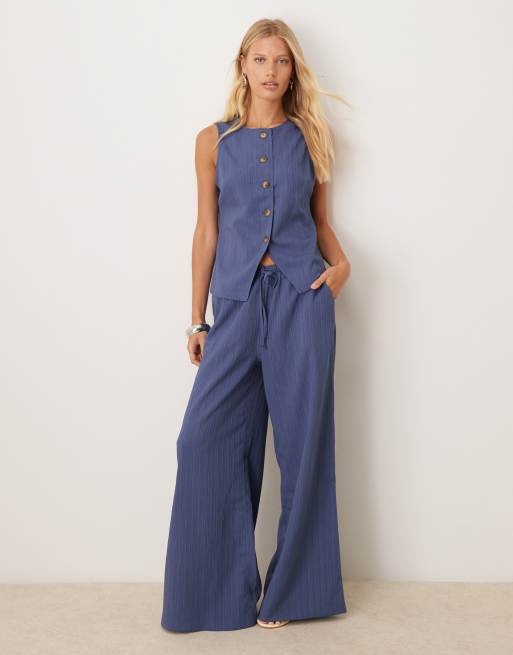ASOS DESIGN - Co-ord set van gilet en palazzo-broek van kreukelstof in denimblauw